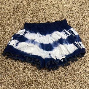 These shorts are a very soft material and has little puff balls at the bottom.